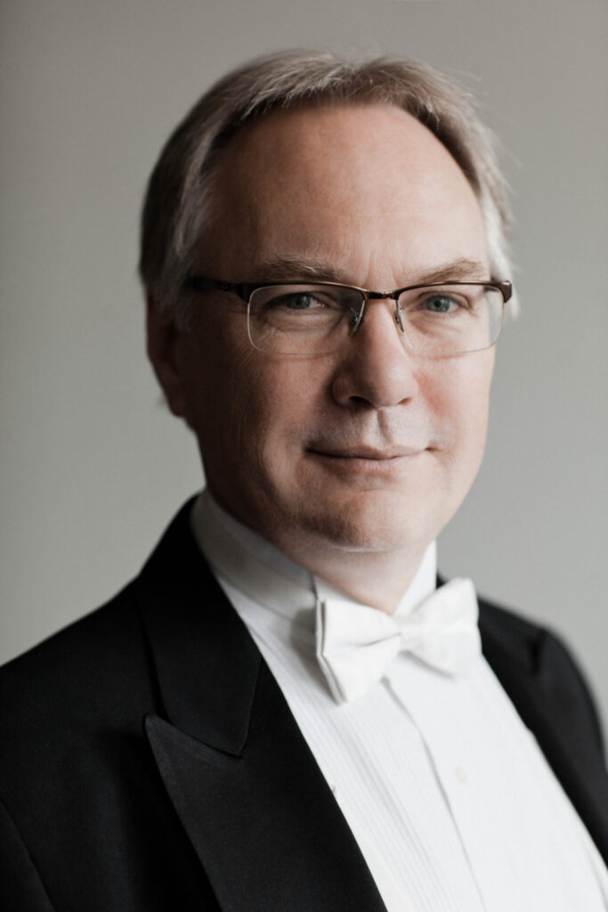 A professional headshot of Dr. Timothy Mahr who is dressed in a tuxedo.