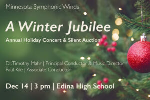 This image is a horizontal rectangle with a medium green background. The right half of the image is a close up of a section of a Christmas tree decorated with lit clear lights. About a vertical foot of the tree is visible on the outer edge of the tree, and only the closest branches are in focus. A textured red bulb ornament is hanging from a branch, with small coordinating red berries blurred in the background. On the left half of the image is off-white text: Minnesota Symphonic Winds A Winter Jubilee Annual Holiday Concert & Silent Auction Dr. Timothy Mahr | Principal Conductor Paul Kile | Associate Conductor Dec 14 | 3 pm | Edina High School